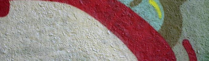 Street art. Abstract background image of a fragment of a colored graffiti painting in chrome and red tones photo