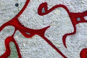 Street art. Abstract background image of a fragment of a colored graffiti painting in chrome and red tones photo