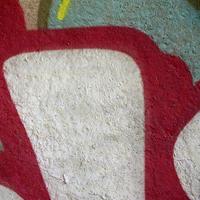 Street art. Abstract background image of a fragment of a colored graffiti painting in chrome and red tones photo