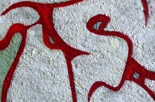 Street art. Abstract background image of a fragment of a colored graffiti painting in chrome and red tones photo