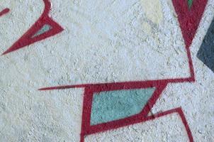 Street art. Abstract background image of a fragment of a colored graffiti painting in chrome and red tones photo