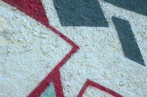 Street art. Abstract background image of a fragment of a colored graffiti painting in chrome and red tones photo