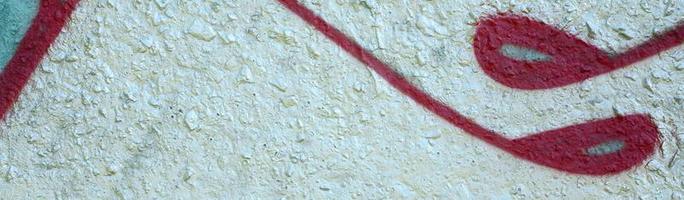 Street art. Abstract background image of a fragment of a colored graffiti painting in chrome and red tones photo