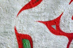 Street art. Abstract background image of a fragment of a colored graffiti painting in chrome and red tones photo