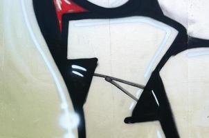 Street art. Abstract background image of a fragment of a colored graffiti painting in chrome and red tones photo