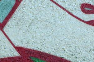 Street art. Abstract background image of a fragment of a colored graffiti painting in chrome and red tones photo