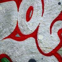 Street art. Abstract background image of a fragment of a colored graffiti painting in chrome and red tones photo