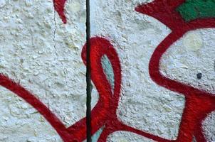 Street art. Abstract background image of a fragment of a colored graffiti painting in chrome and red tones photo