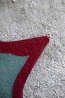 Street art. Abstract background image of a fragment of a colored graffiti painting in chrome and red tones photo