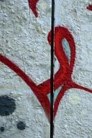 Street art. Abstract background image of a fragment of a colored graffiti painting in chrome and red tones photo