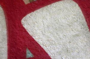 Street art. Abstract background image of a fragment of a colored graffiti painting in chrome and red tones photo