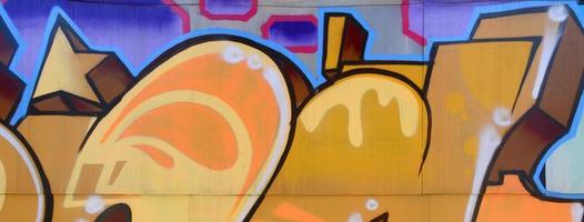 Street art. Abstract background image of a fragment of a colored graffiti painting in beige and orange tones photo