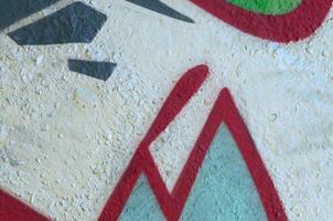 Street art. Abstract background image of a fragment of a colored graffiti painting in chrome and red tones photo