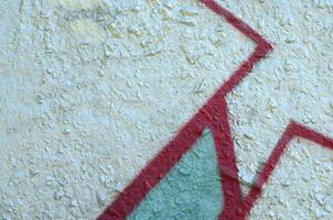 Street art. Abstract background image of a fragment of a colored graffiti painting in chrome and red tones photo