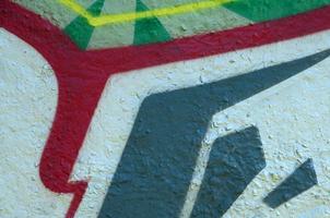 Street art. Abstract background image of a fragment of a colored graffiti painting in chrome and red tones photo