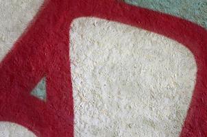 Street art. Abstract background image of a fragment of a colored graffiti painting in chrome and red tones photo