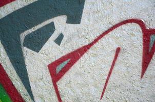 Street art. Abstract background image of a fragment of a colored graffiti painting in chrome and red tones photo