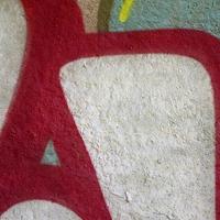 Street art. Abstract background image of a fragment of a colored graffiti painting in chrome and red tones photo