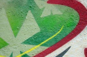 Street art. Abstract background image of a fragment of a colored graffiti painting in chrome and red tones photo