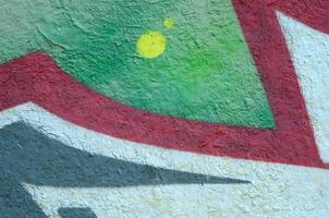 Street art. Abstract background image of a fragment of a colored graffiti painting in chrome and red tones photo