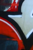 Street art. Abstract background image of a fragment of a colored graffiti painting in chrome and red tones photo