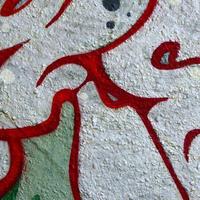 Street art. Abstract background image of a fragment of a colored graffiti painting in chrome and red tones photo