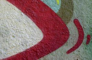 Street art. Abstract background image of a fragment of a colored graffiti painting in chrome and red tones photo