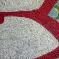 Street art. Abstract background image of a fragment of a colored graffiti painting in chrome and red tones photo