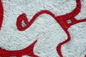 Street art. Abstract background image of a fragment of a colored graffiti painting in chrome and red tones photo