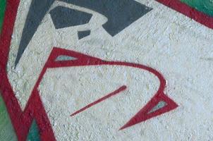 Street art. Abstract background image of a fragment of a colored graffiti painting in chrome and red tones photo