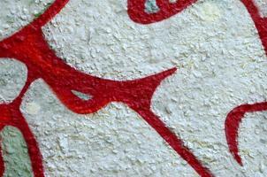 Street art. Abstract background image of a fragment of a colored graffiti painting in chrome and red tones photo