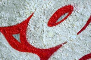 Street art. Abstract background image of a fragment of a colored graffiti painting in chrome and red tones photo