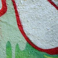 Street art. Abstract background image of a fragment of a colored graffiti painting in chrome and red tones photo