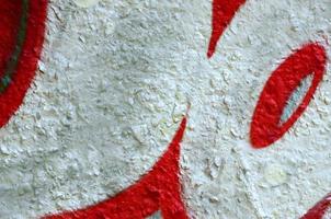 Street art. Abstract background image of a fragment of a colored graffiti painting in chrome and red tones photo