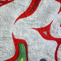 Street art. Abstract background image of a fragment of a colored graffiti painting in chrome and red tones photo