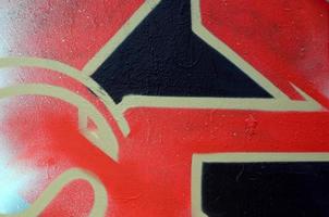 Street art. Abstract background image of a fragment of a colored graffiti painting in red tones photo