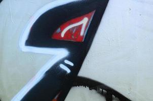 Street art. Abstract background image of a fragment of a colored graffiti painting in chrome and red tones photo