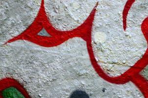 Street art. Abstract background image of a fragment of a colored graffiti painting in chrome and red tones photo