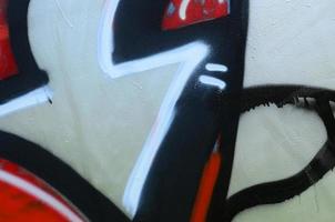 Street art. Abstract background image of a fragment of a colored graffiti painting in chrome and red tones photo