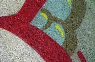 Street art. Abstract background image of a fragment of a colored graffiti painting in chrome and red tones photo