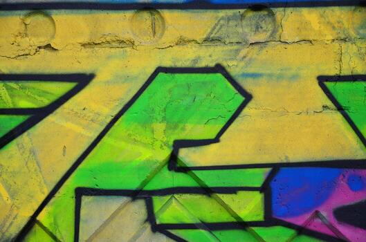 Texture of a fragment of the wall with graffiti painting, which is depicted on it. An image of a piece of graffiti drawing as a photo on street art and graffiti culture topics