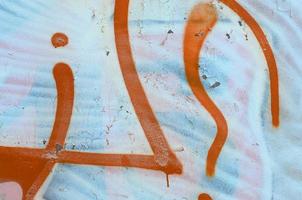 Street art. Abstract background image of a fragment of a colored graffiti painting in white and orange tones photo