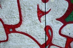 Street art. Abstract background image of a fragment of a colored graffiti painting in chrome and red tones photo