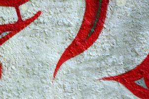 Street art. Abstract background image of a fragment of a colored graffiti painting in chrome and red tones photo