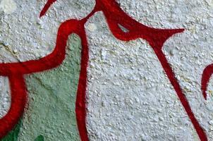 Street art. Abstract background image of a fragment of a colored graffiti painting in chrome and red tones photo