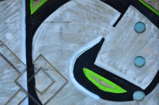 Texture of a fragment of the wall with graffiti painting, which is depicted on it. An image of a piece of graffiti drawing as a photo on street art and graffiti culture topics