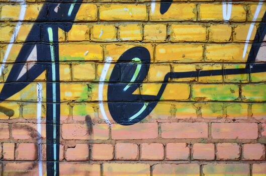 Texture of a fragment of the wall with graffiti painting, which is depicted on it. An image of a piece of graffiti drawing as a photo on street art and graffiti culture topics