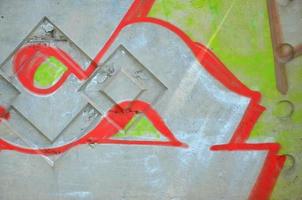 Texture of a fragment of the wall with graffiti painting, which is depicted on it. An image of a piece of graffiti drawing as a photo on street art and graffiti culture topics