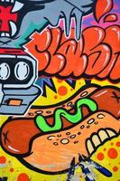 A detailed image of the graffiti drawing. A conceptual street art background with a hot dog photo