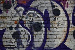 Art under ground. Beautiful street art graffiti style. The wall is decorated with abstract drawings house paint. Modern iconic urban culture of street youth. Abstract stylish picture on wall photo